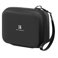 Estuche negro para cámaras compactas con compartimentos internos y correa de transporte